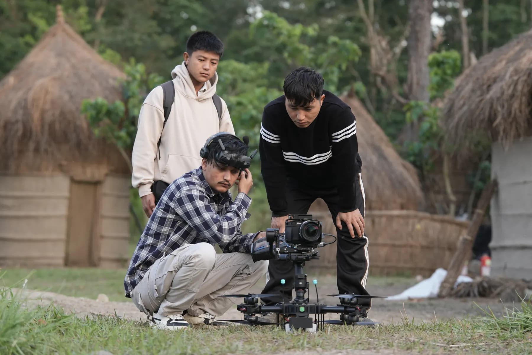 Adarsha and a film crew setting up an FPV cinema rig on location