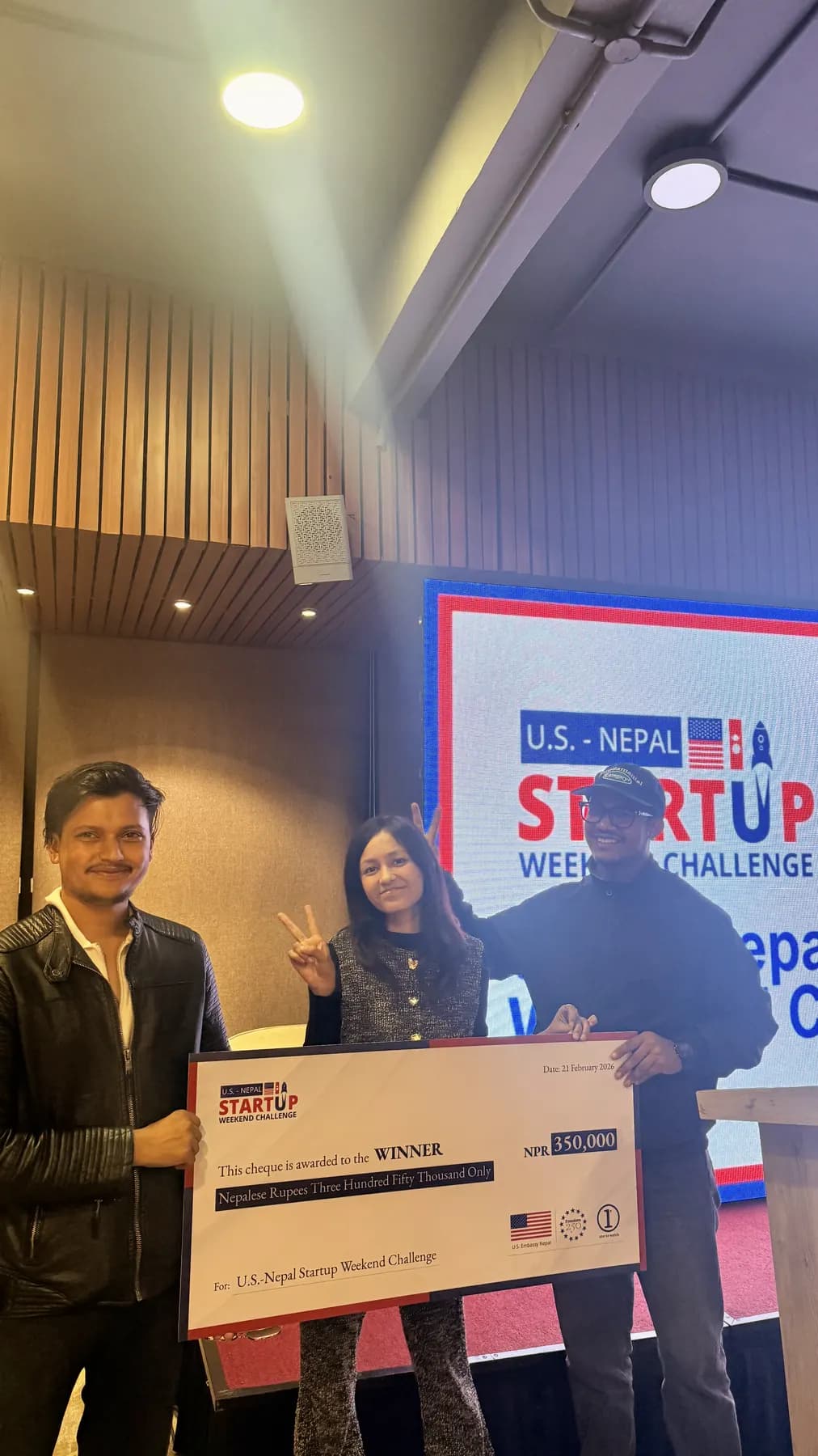 GarudX receiving the US-Nepal Startup Weekend Challenge winner's cheque, February 2026