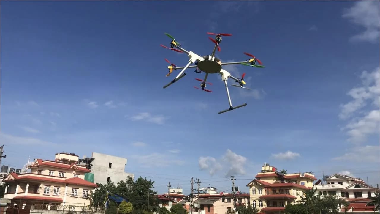 A homemade hexacopter flying over rooftops