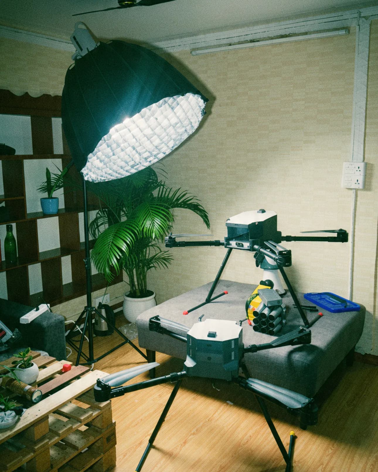 The GarudX studio: drones on stands and a heavy-lift drone under a softbox