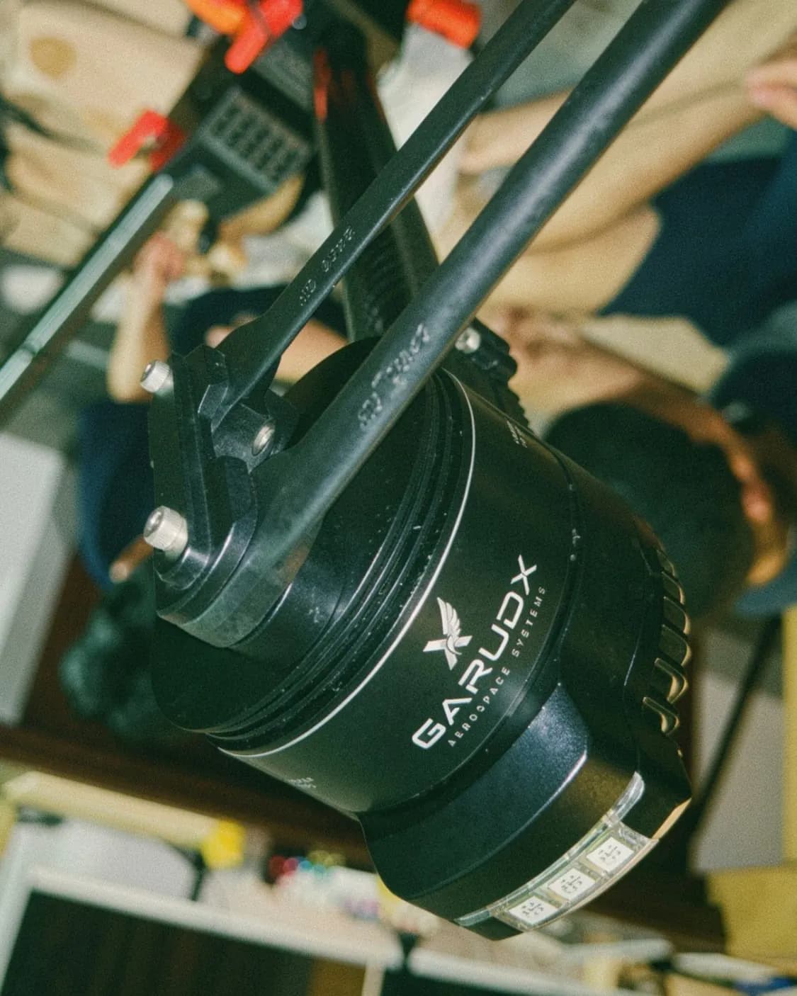 Close-up of a GarudX-branded motor on Hydra's arm